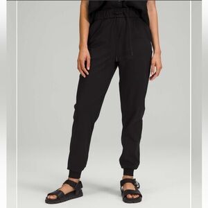 Lululemon Black Track Pants with Tapered Fit and Elastic Cuffs
